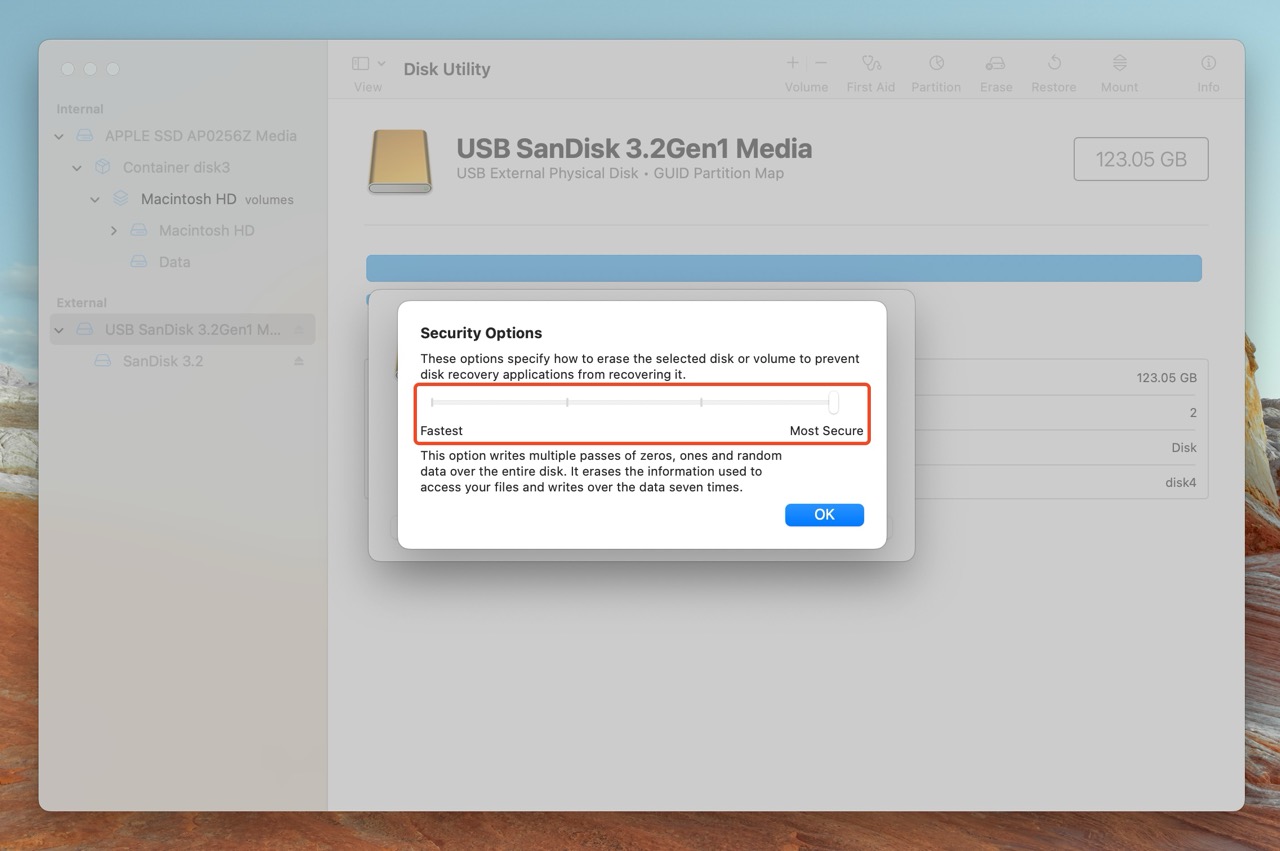 Disk Utility no Mac mostrando o controle deslizante "Opções de Segurança" para apagar um disco.